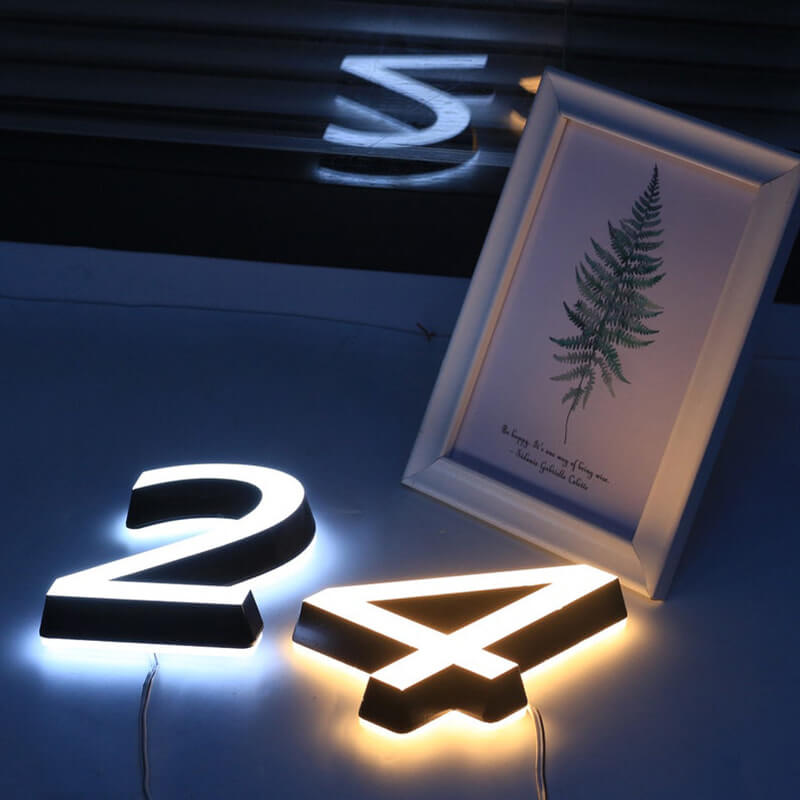 Low-voltage outdoor house numbers with two-sided glow